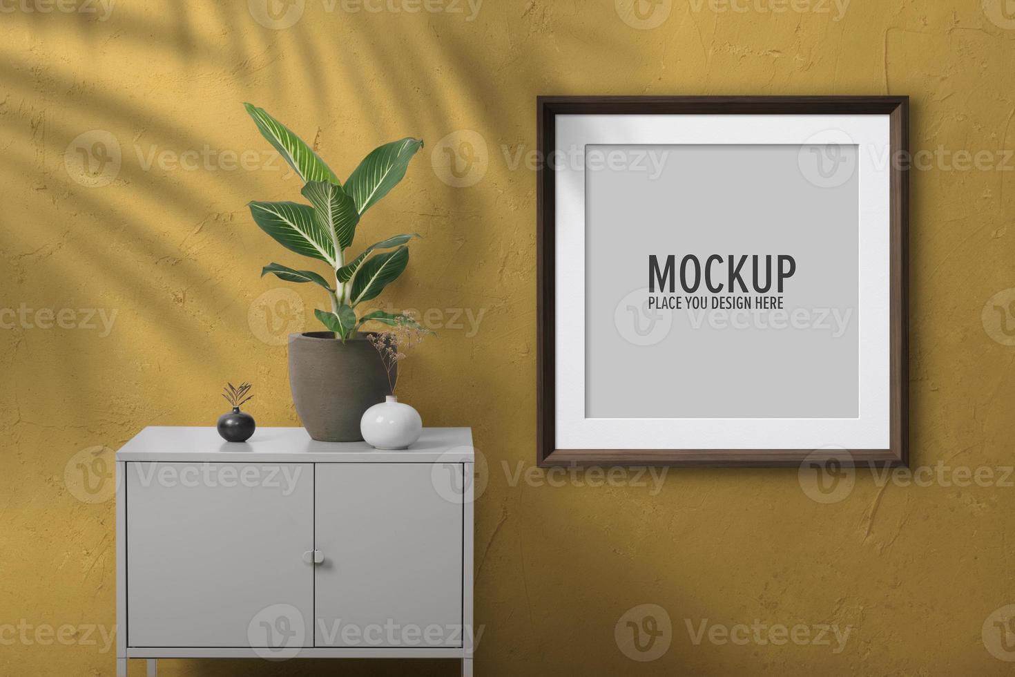 Template frame mockup on a yellow surface wall photo
