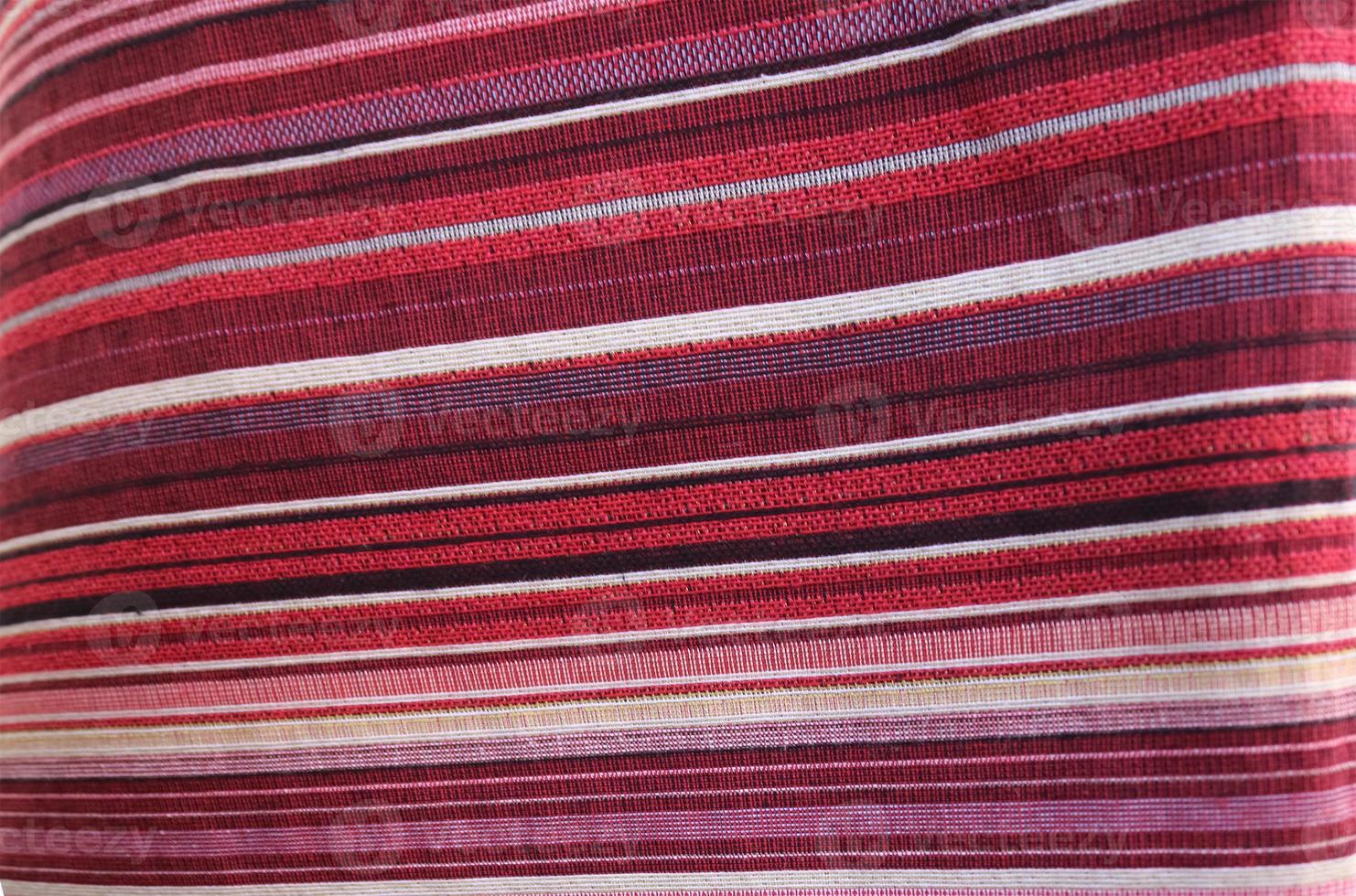 Detailed close up view on samples of cloth and fabrics in different colors found at a fabrics market photo