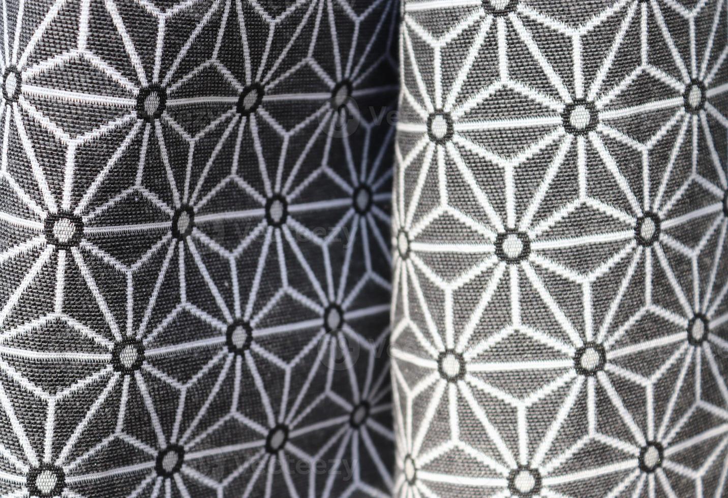 Detailed close up view on samples of cloth and fabrics in different colors found at a fabrics market photo