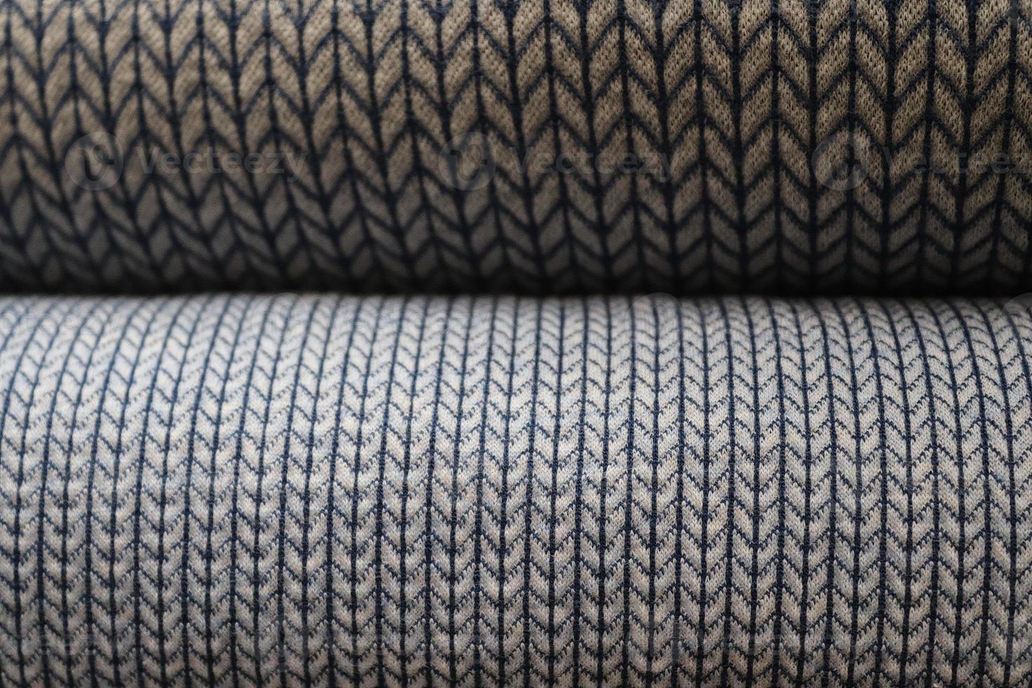 Detailed close up view on samples of cloth and fabrics in different colors found at a fabrics market photo