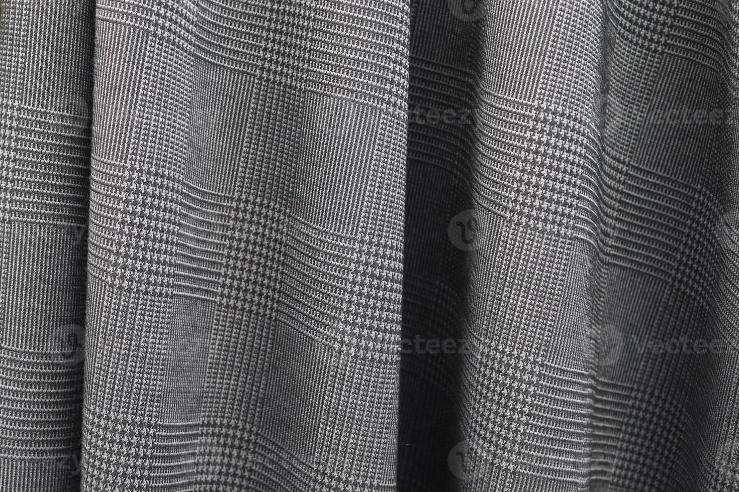 Detailed close up view on samples of cloth and fabrics in different colors found at a fabrics market photo