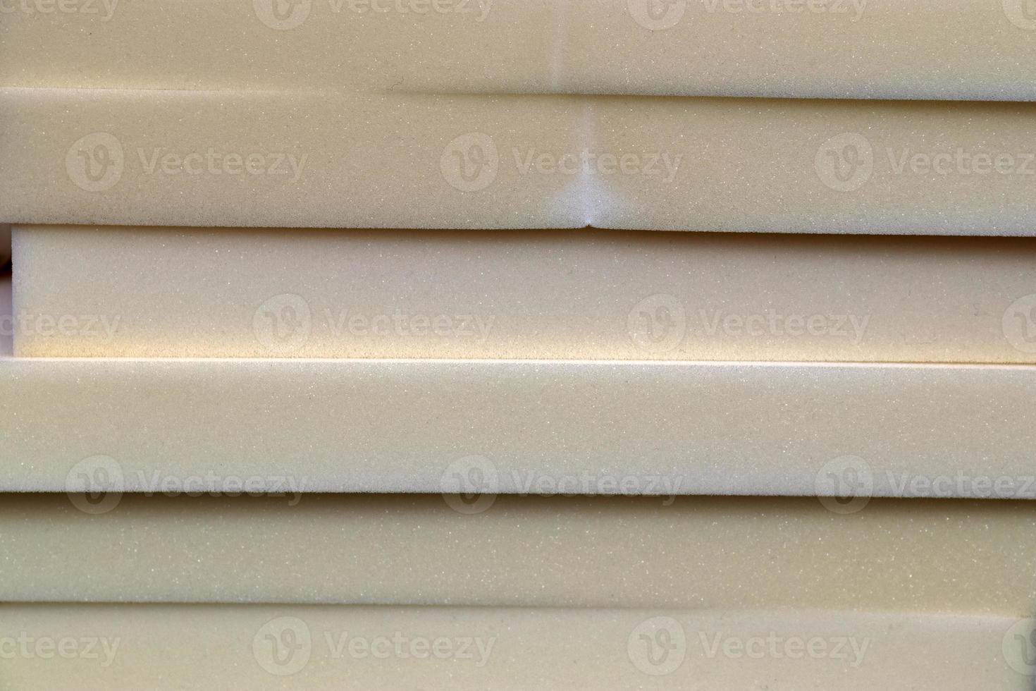 Detailed close up view on samples of cloth and fabrics in different colors found at a fabrics market photo