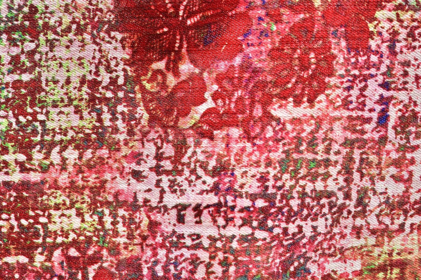 Detailed close up view on samples of cloth and fabrics in different colors found at a fabrics market photo