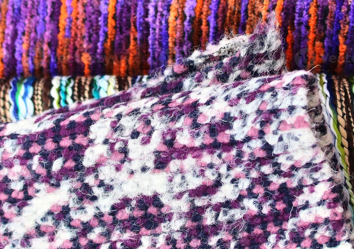 Detailed close up view on samples of cloth and fabrics in different colors found at a fabrics market photo