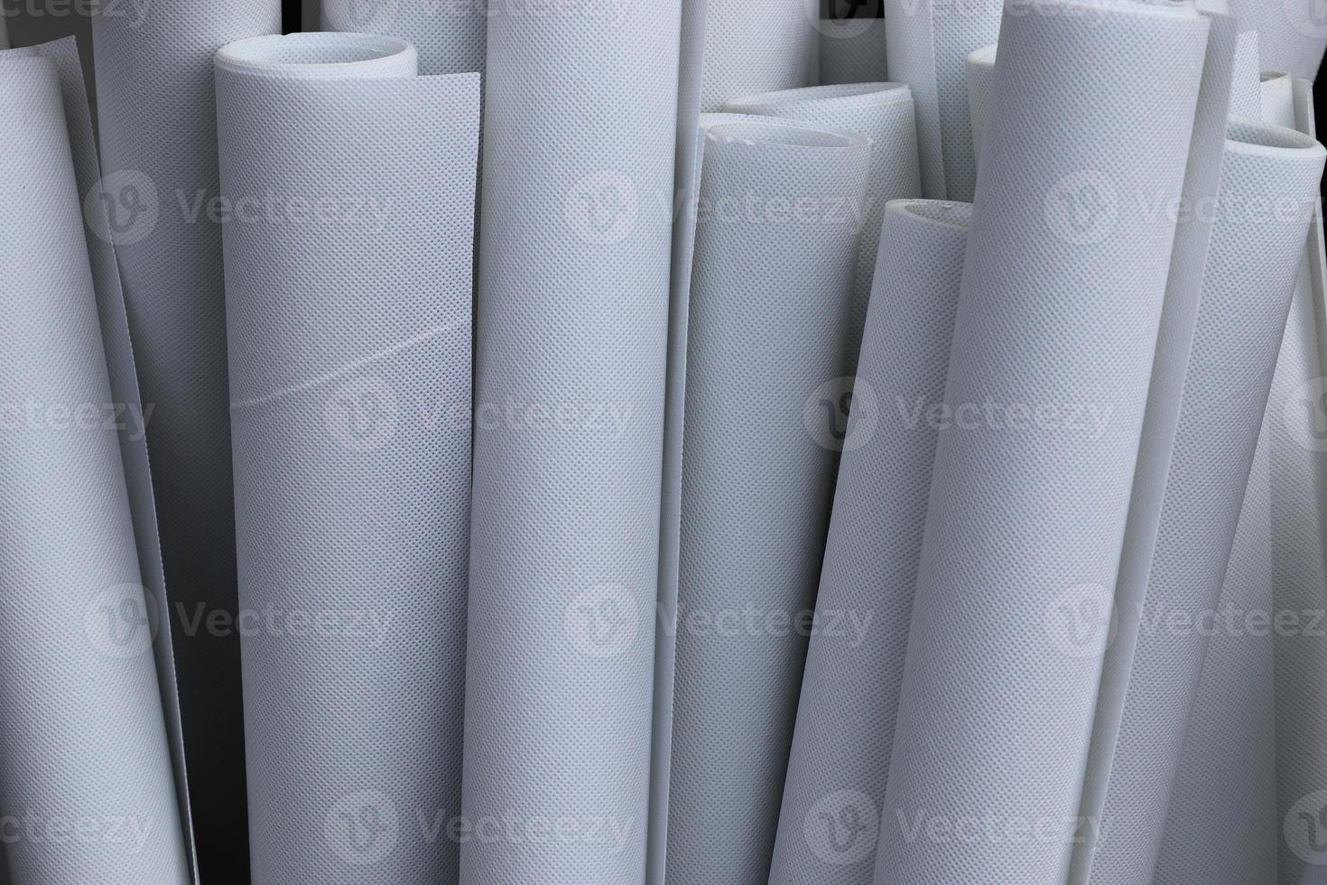 Detailed close up view on samples of cloth and fabrics in different colors found at a fabrics market photo