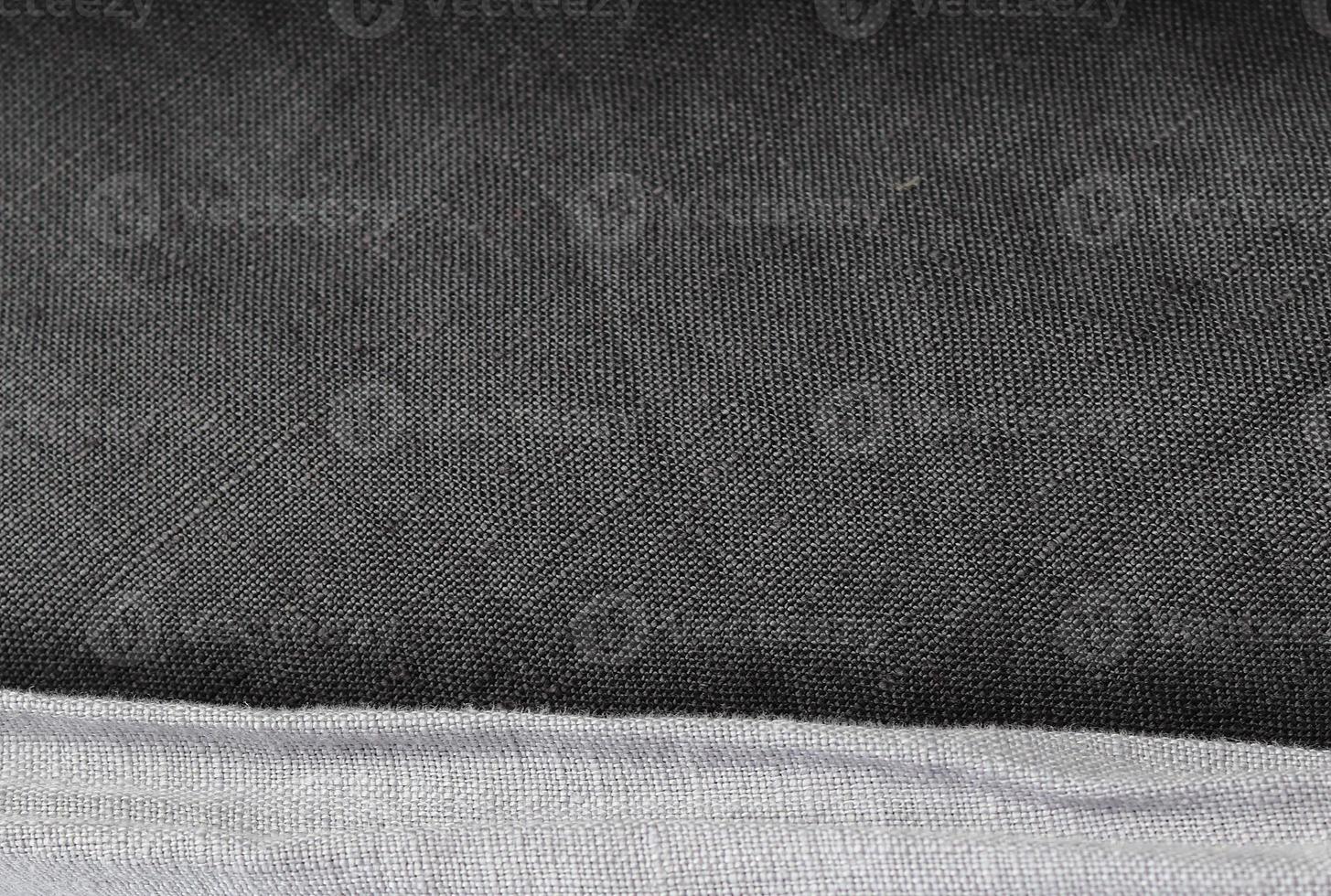 Detailed close up view on samples of cloth and fabrics in different colors found at a fabrics market photo