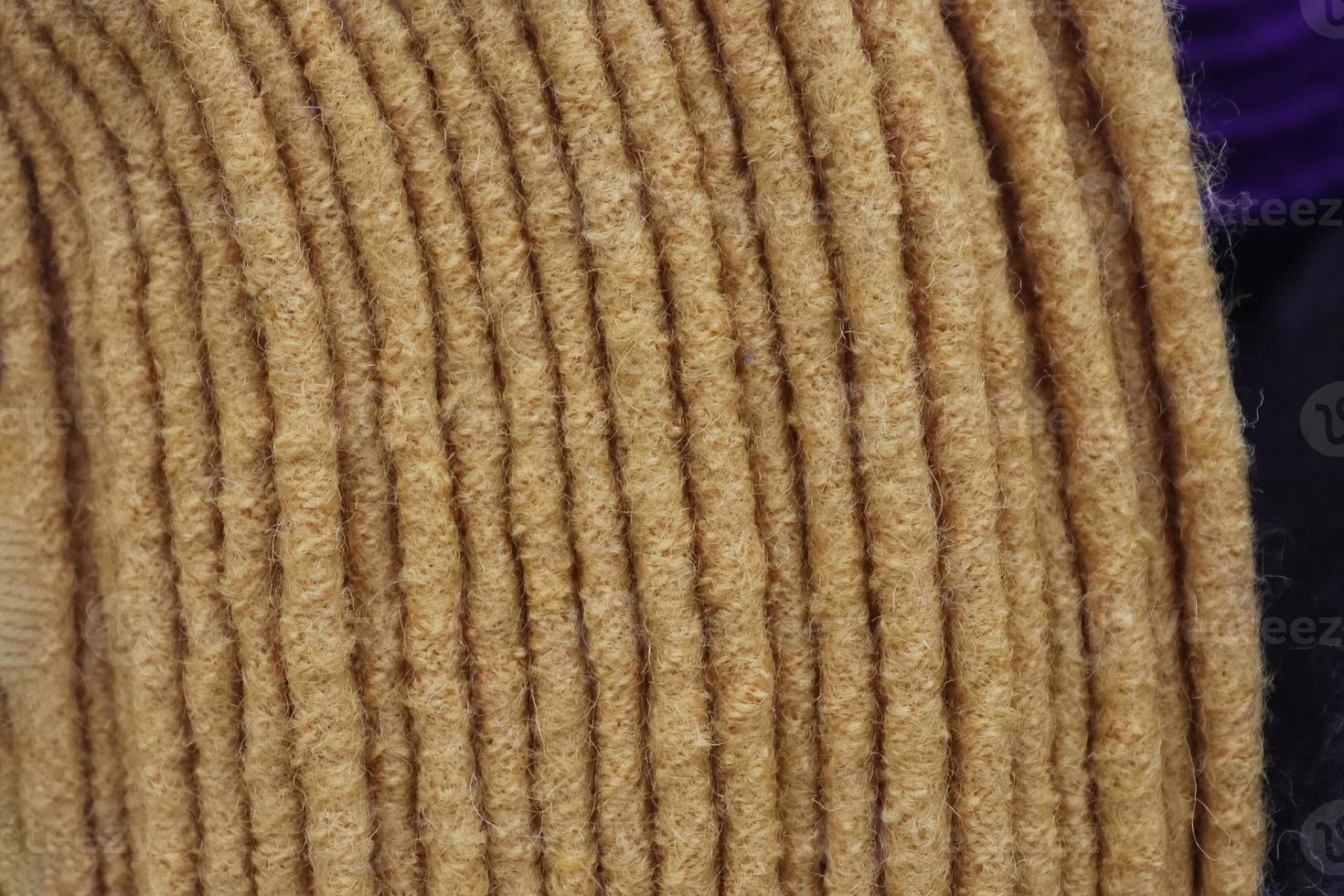 Detailed close up view on samples of cloth and fabrics in different colors found at a fabrics market photo