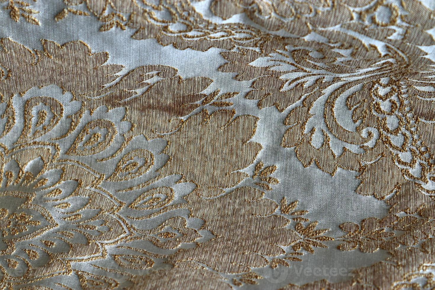 Detailed close up view on samples of cloth and fabrics in different colors found at a fabrics market photo