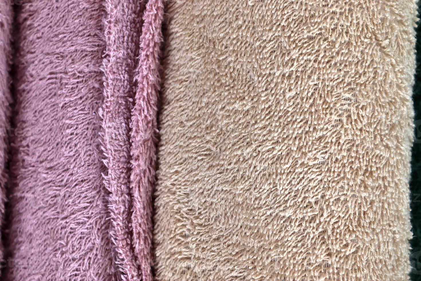 Detailed close up view on samples of cloth and fabrics in different colors found at a fabrics market photo