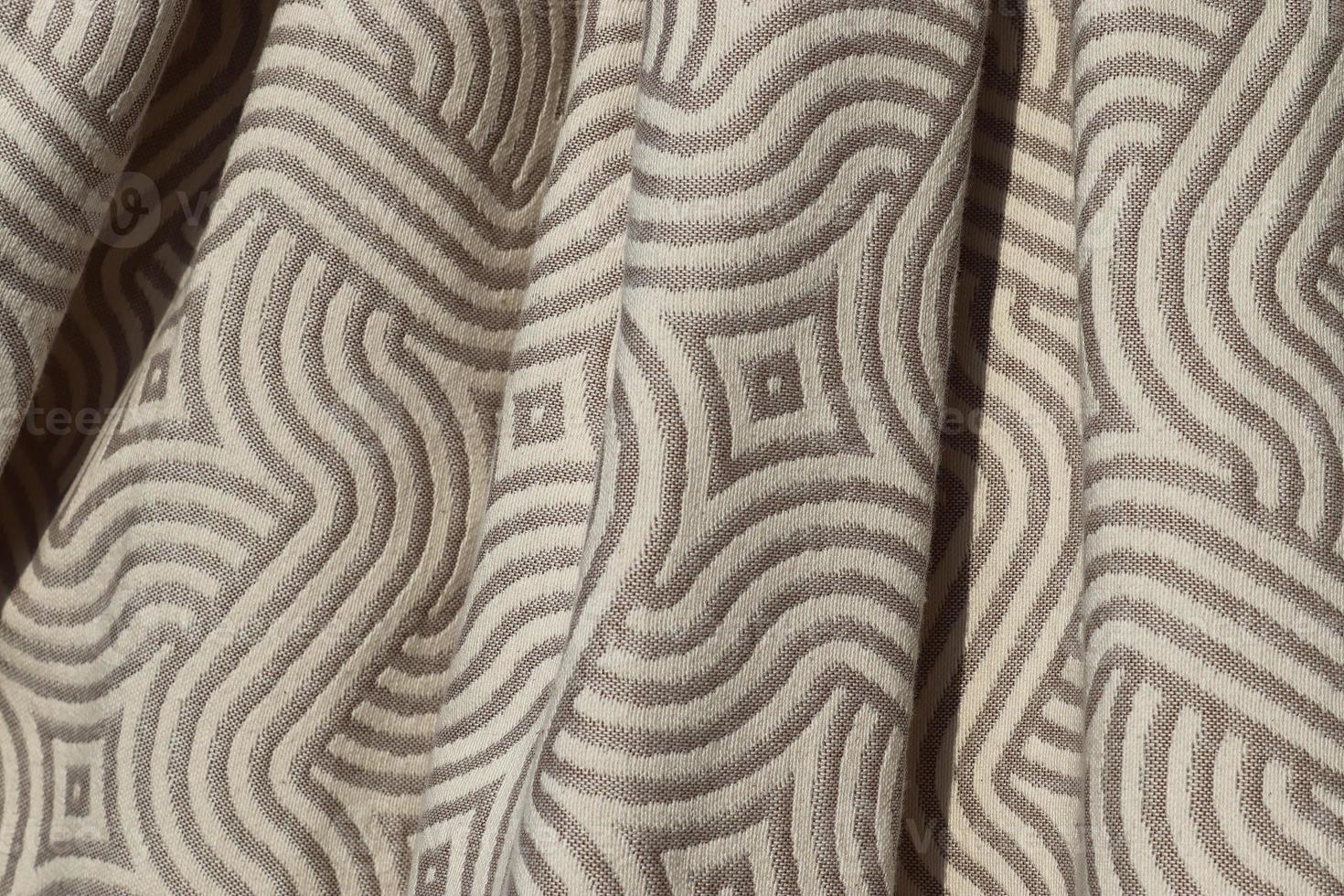 Detailed close up view on samples of cloth and fabrics in different colors found at a fabrics market photo