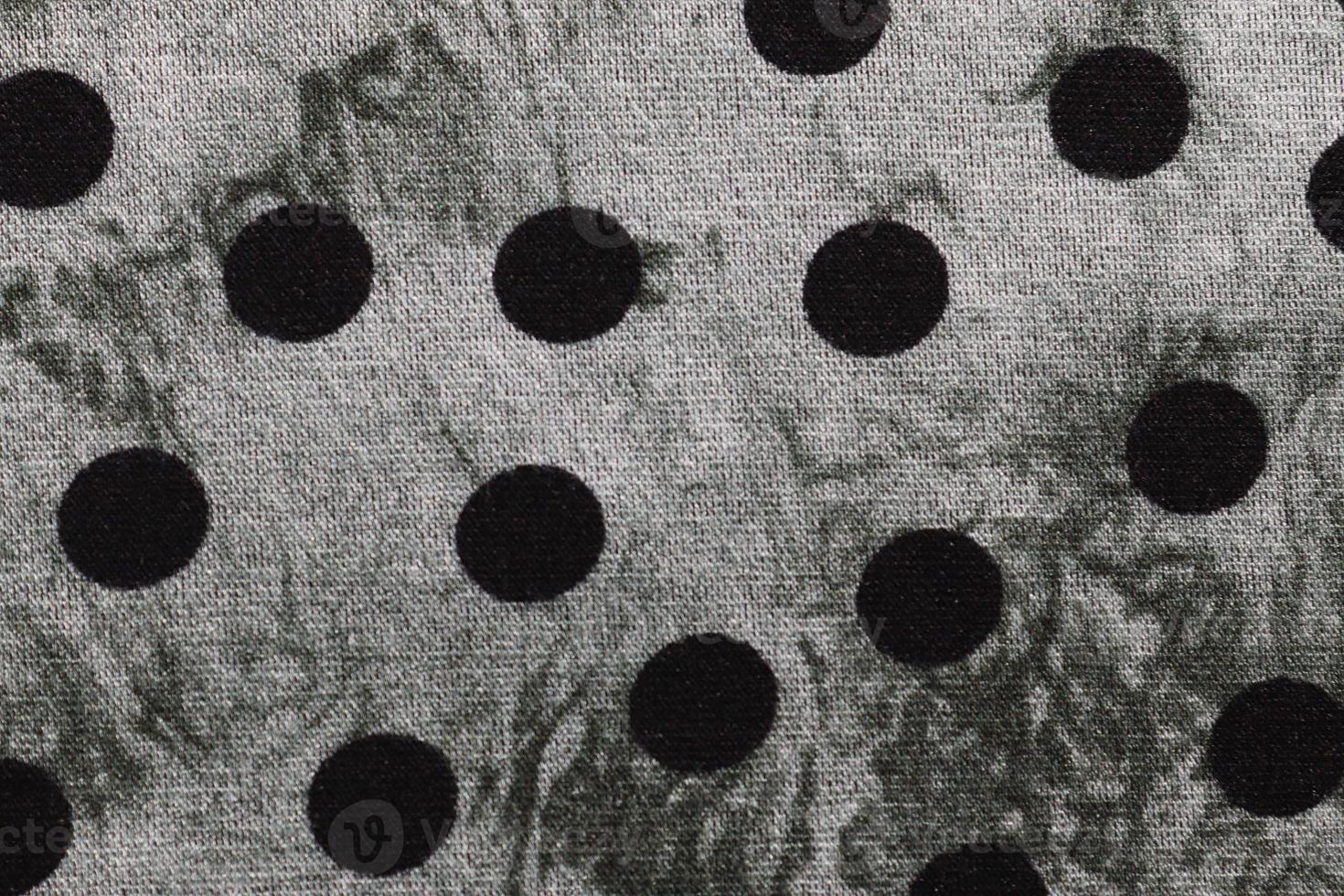 Detailed close up view on samples of cloth and fabrics in different colors found at a fabrics market photo