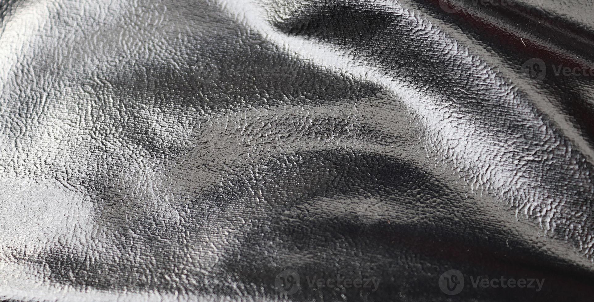 Detailed close up view on samples of cloth and fabrics in different colors found at a fabrics market photo