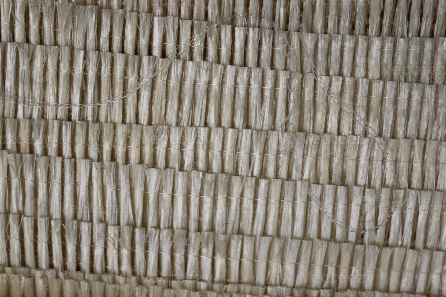 Detailed close up view on samples of cloth and fabrics in different colors found at a fabrics market photo