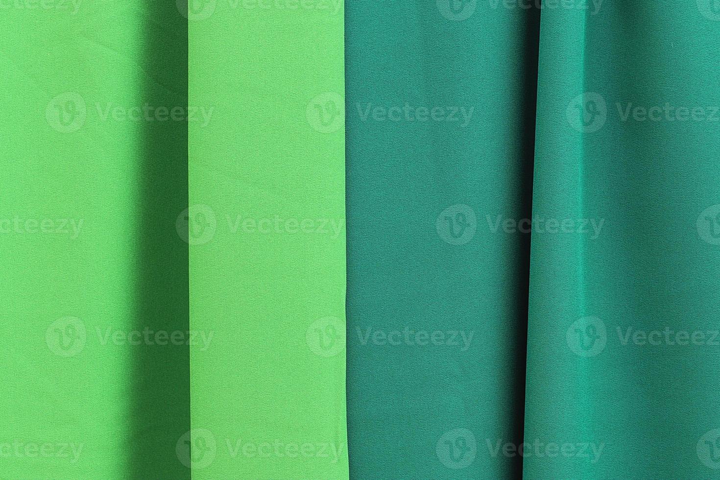 Detailed close up view on samples of cloth and fabrics in different colors found at a fabrics market photo