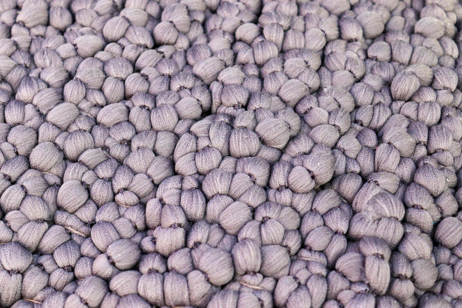 Detailed close up view on samples of cloth and fabrics in different colors found at a fabrics market photo