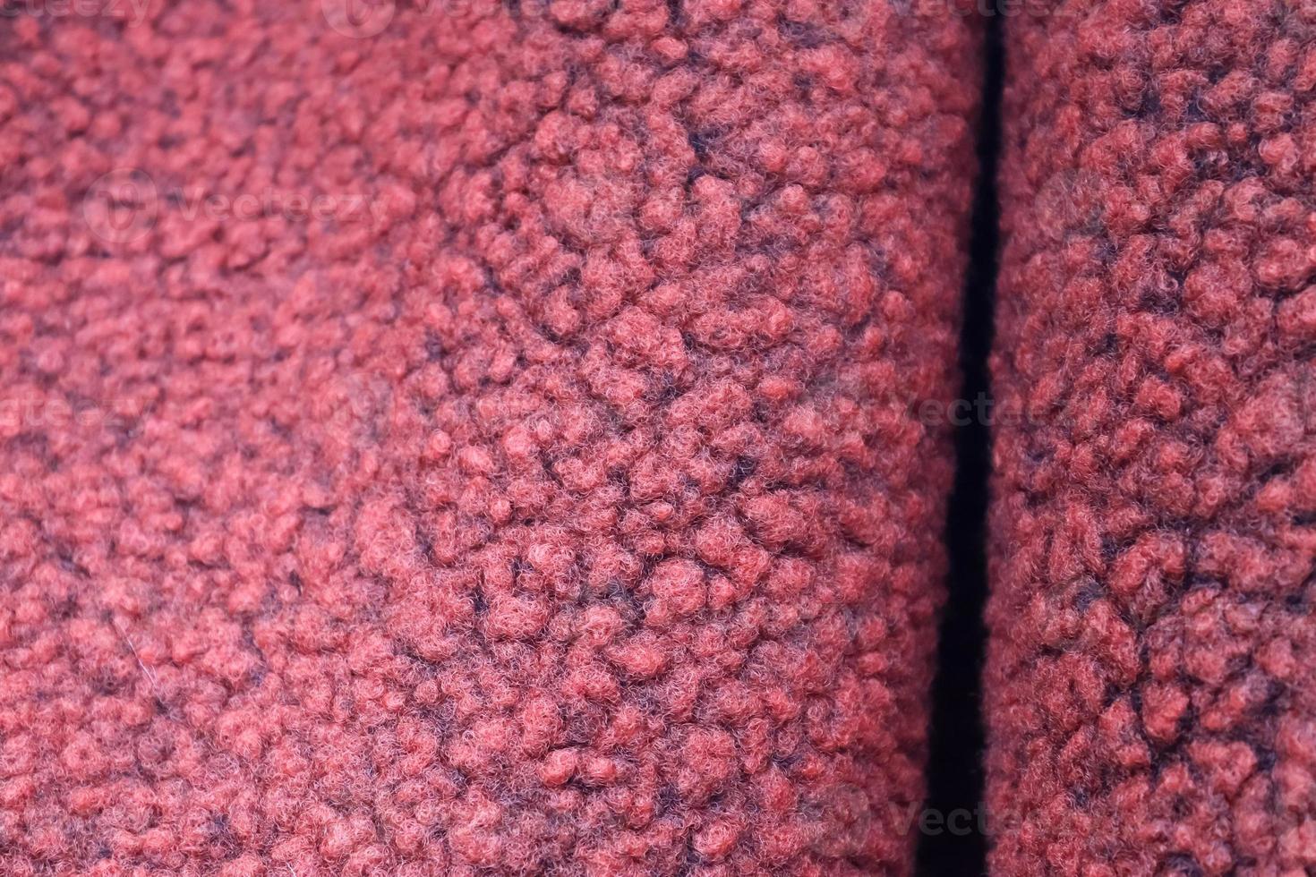 Detailed close up view on samples of cloth and fabrics in different colors found at a fabrics market photo