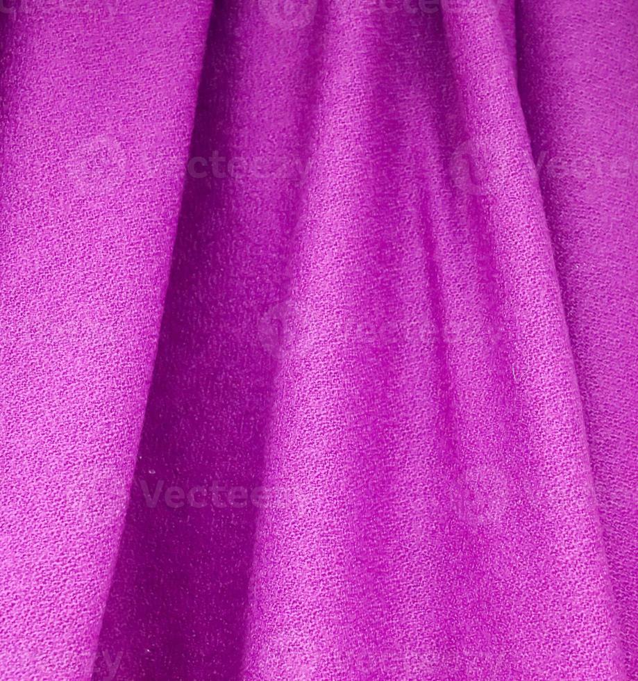 Detailed close up view on samples of cloth and fabrics in different colors found at a fabrics market photo