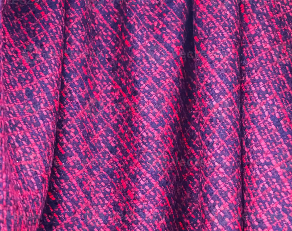 Detailed close up view on samples of cloth and fabrics in different colors found at a fabrics market photo