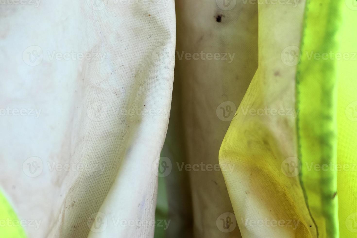 Detailed close up view on samples of cloth and fabrics in different colors found at a fabrics market photo