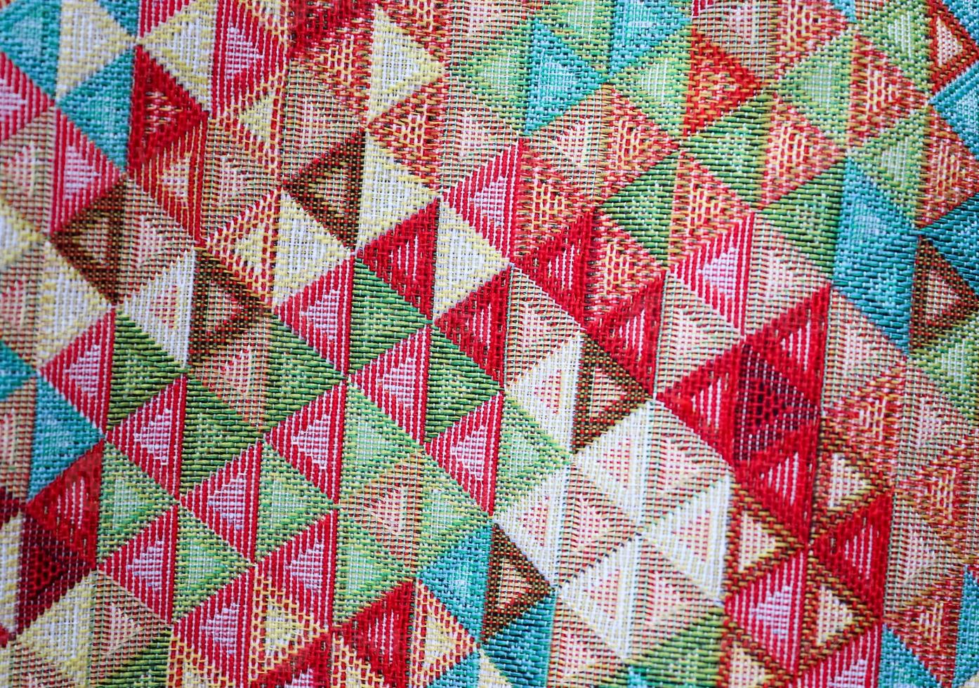 Detailed close up view on samples of cloth and fabrics in different colors found at a fabrics market photo