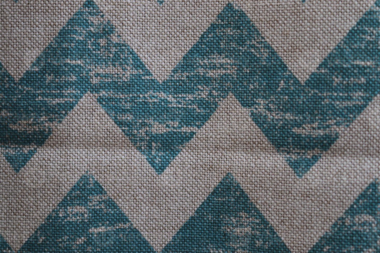 Detailed close up view on samples of cloth and fabrics in different colors found at a fabrics market photo