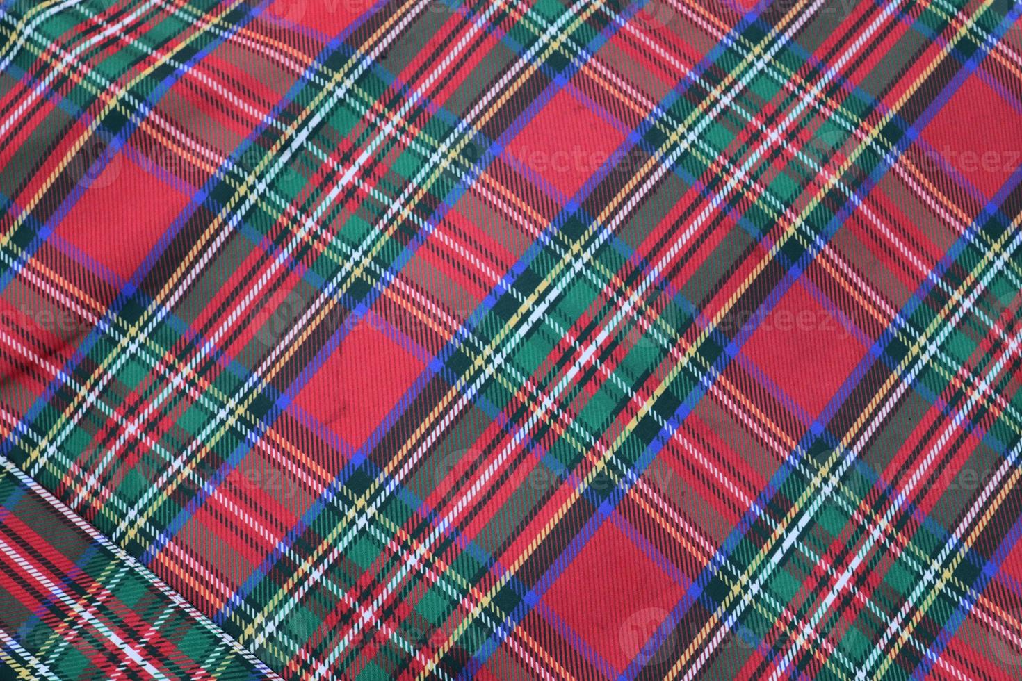 Detailed close up view on samples of cloth and fabrics in different colors found at a fabrics market photo