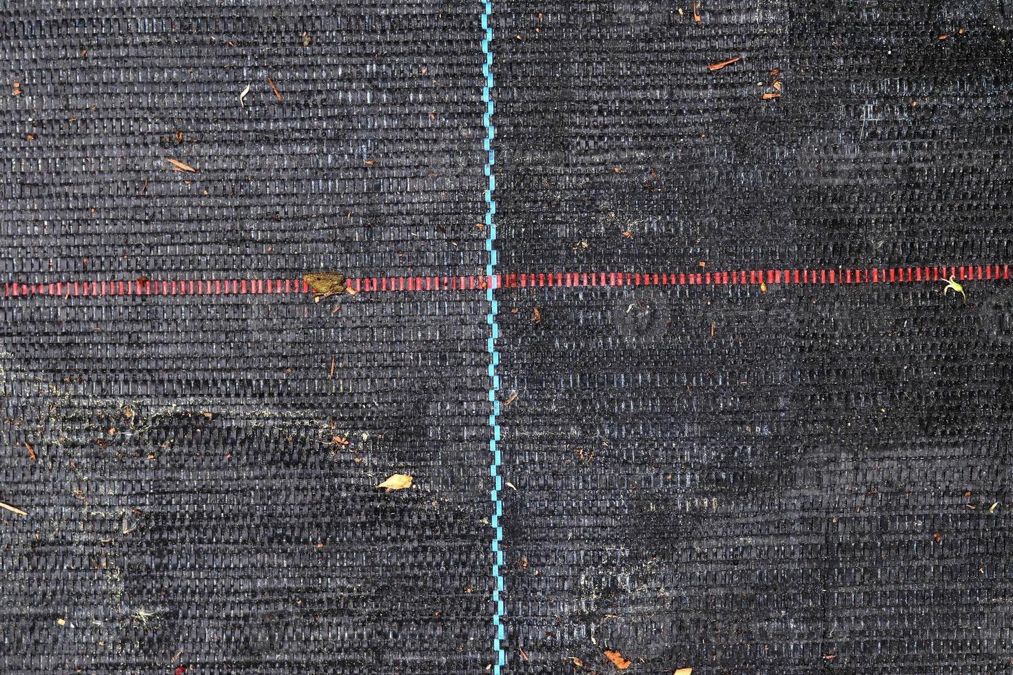 Detailed close up view on samples of cloth and fabrics in different colors found at a fabrics market photo