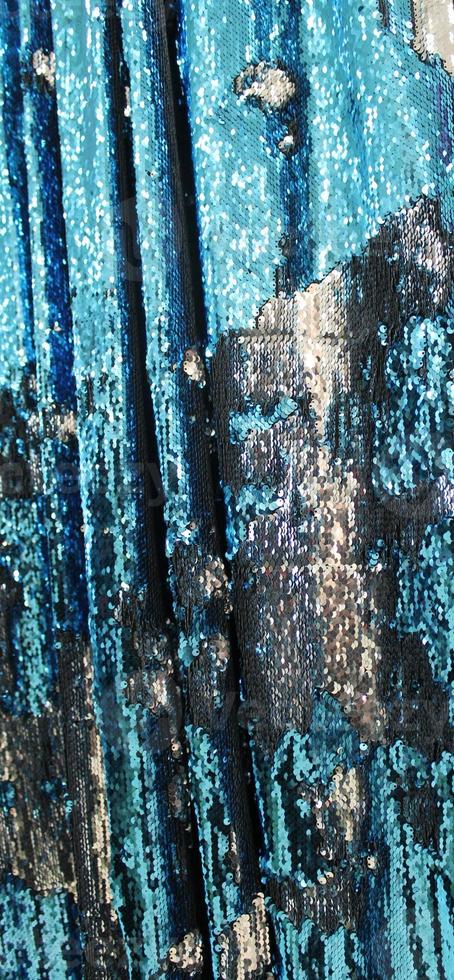 Detailed close up view on samples of cloth and fabrics in different colors found at a fabrics market photo