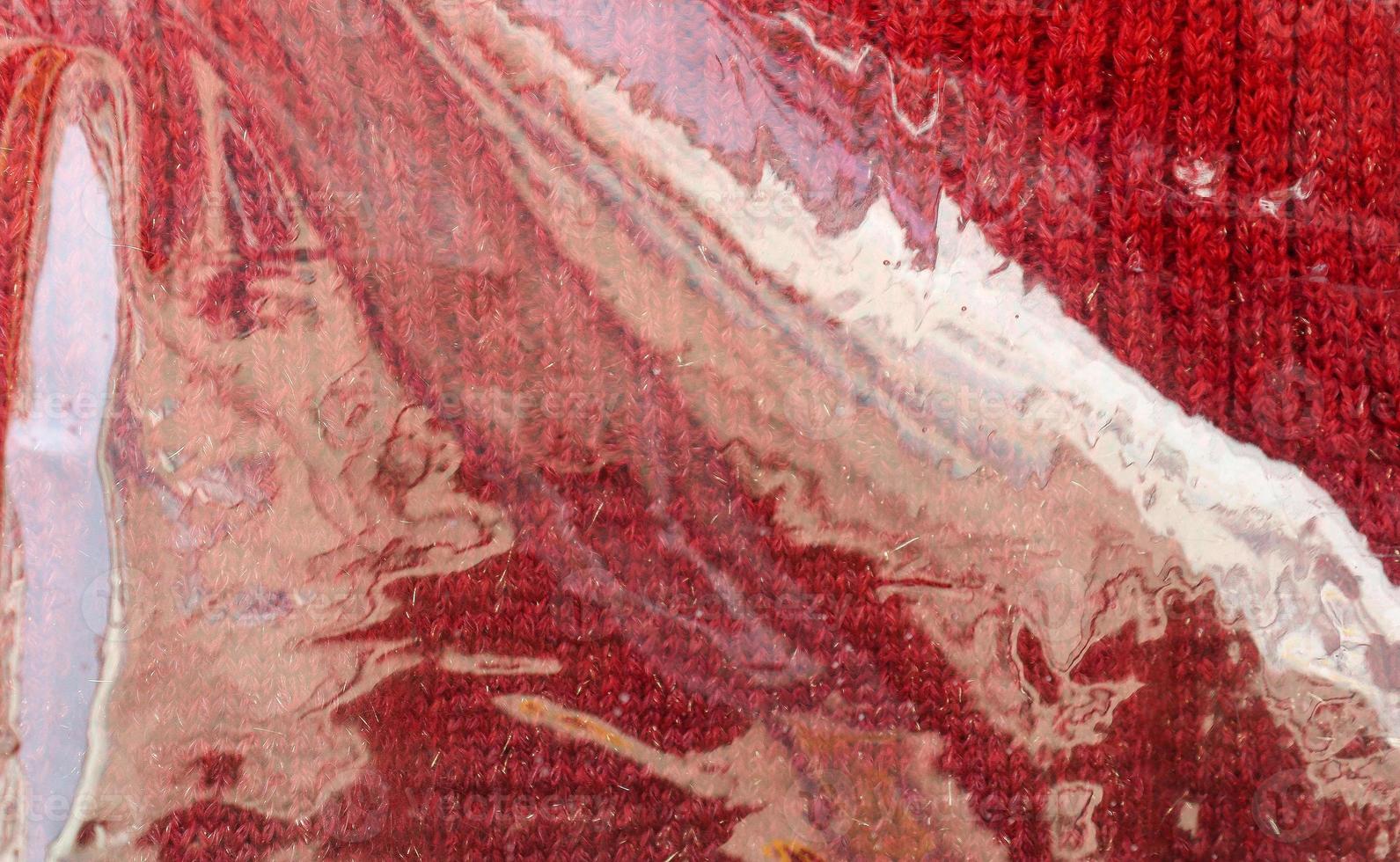 Detailed close up view on samples of cloth and fabrics in different colors found at a fabrics market photo