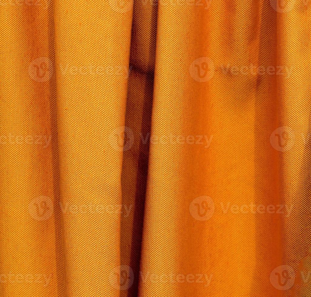 Detailed close up view on samples of cloth and fabrics in different colors found at a fabrics market photo