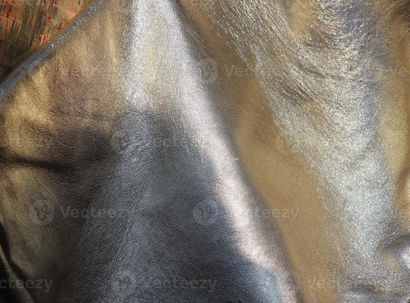 Detailed close up view on samples of cloth and fabrics in different colors found at a fabrics market photo