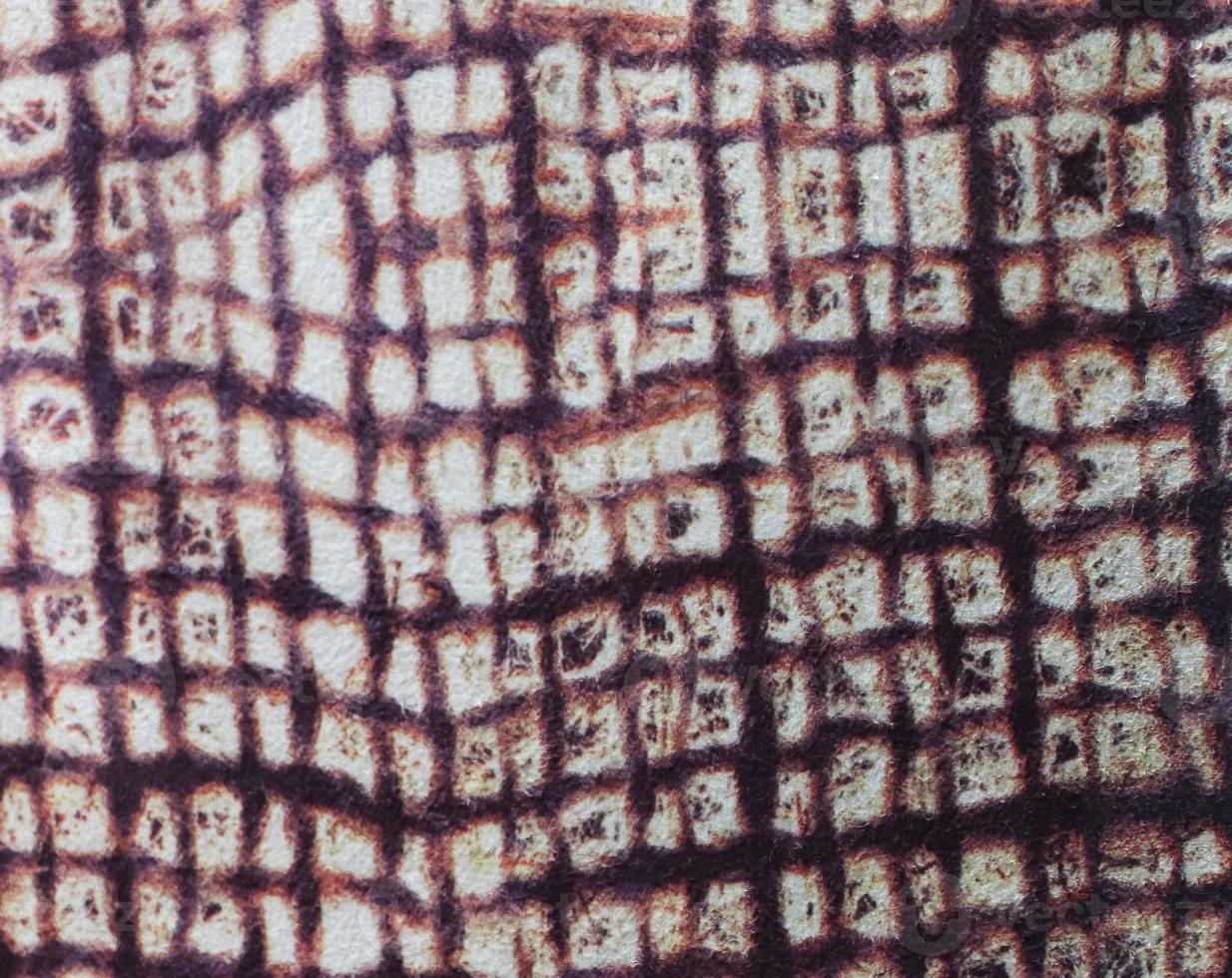 Detailed close up view on samples of cloth and fabrics in different colors found at a fabrics market photo