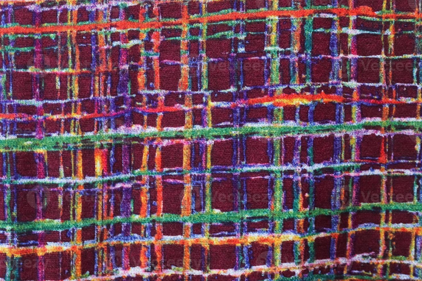 Detailed close up view on samples of cloth and fabrics in different colors found at a fabrics market photo