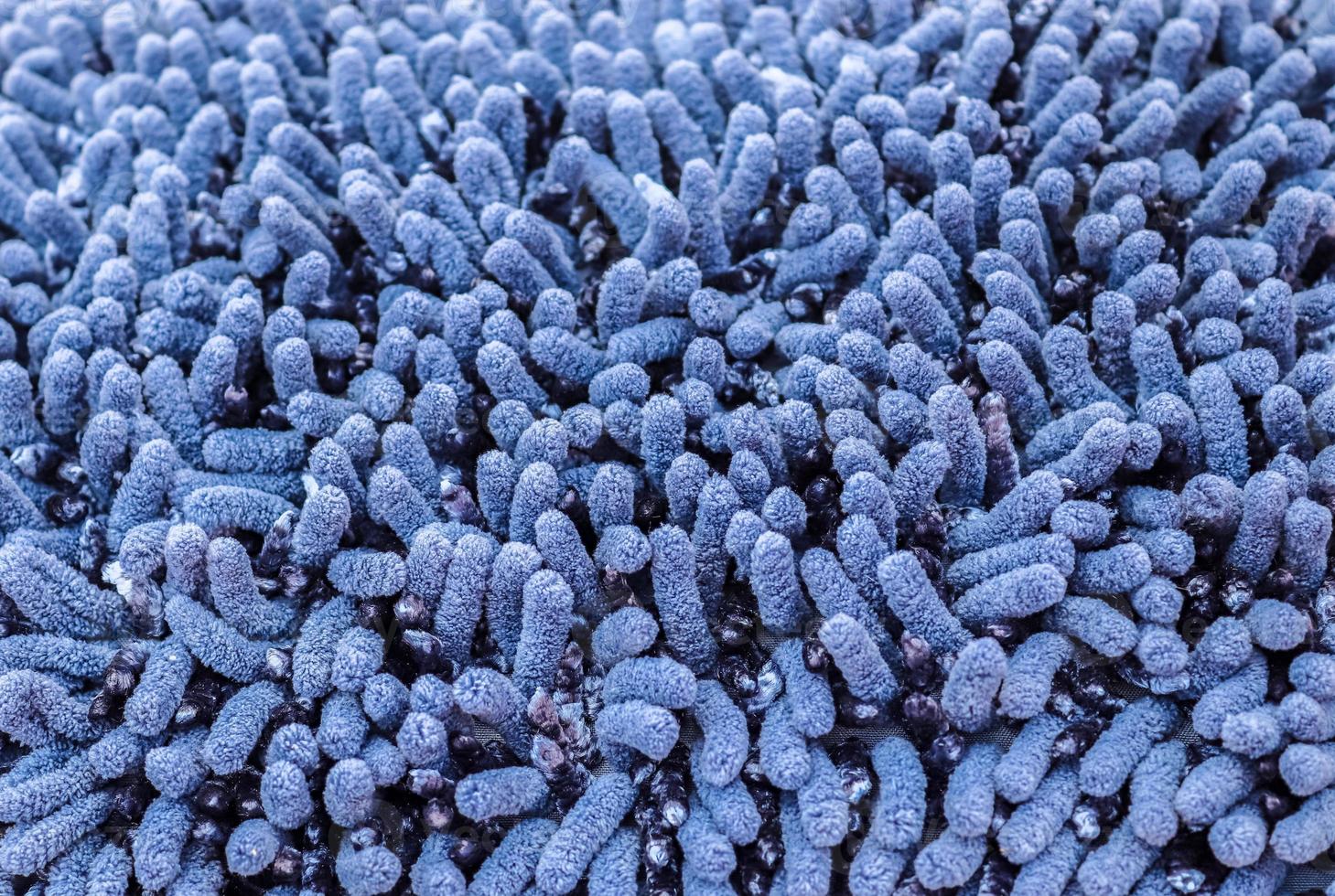 Detailed close up view on samples of cloth and fabrics in different colors found at a fabrics market photo