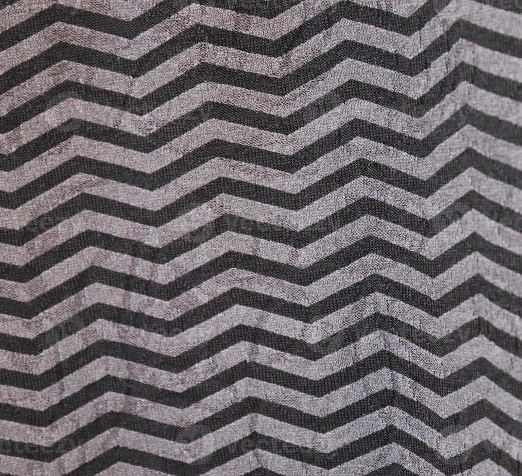 Detailed close up view on samples of cloth and fabrics in different colors found at a fabrics market photo