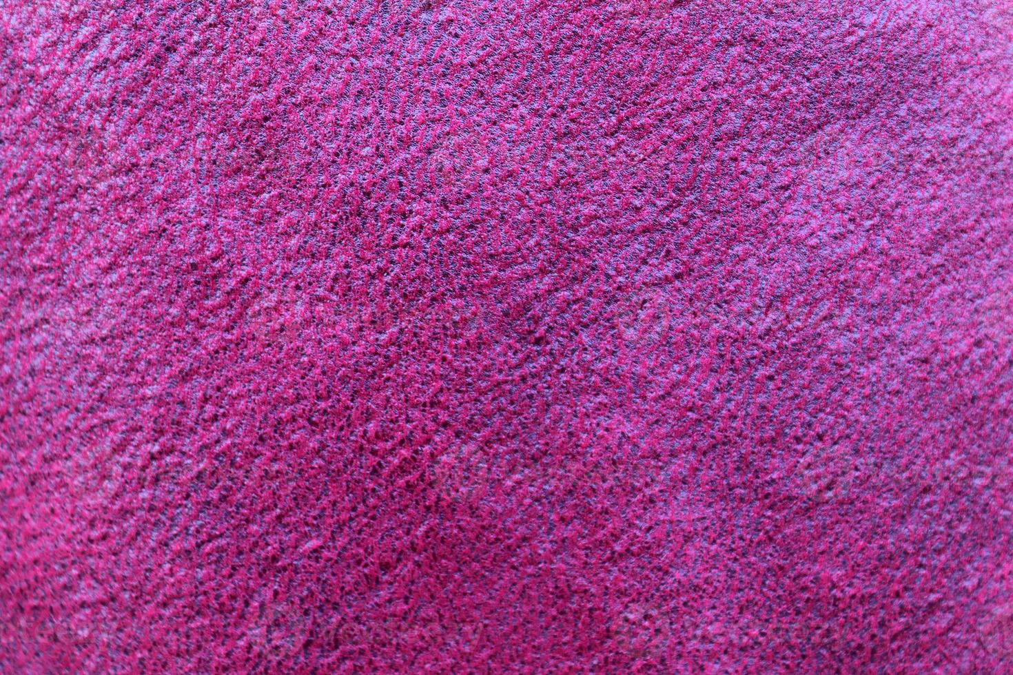 Detailed close up view on samples of cloth and fabrics in different colors found at a fabrics market photo