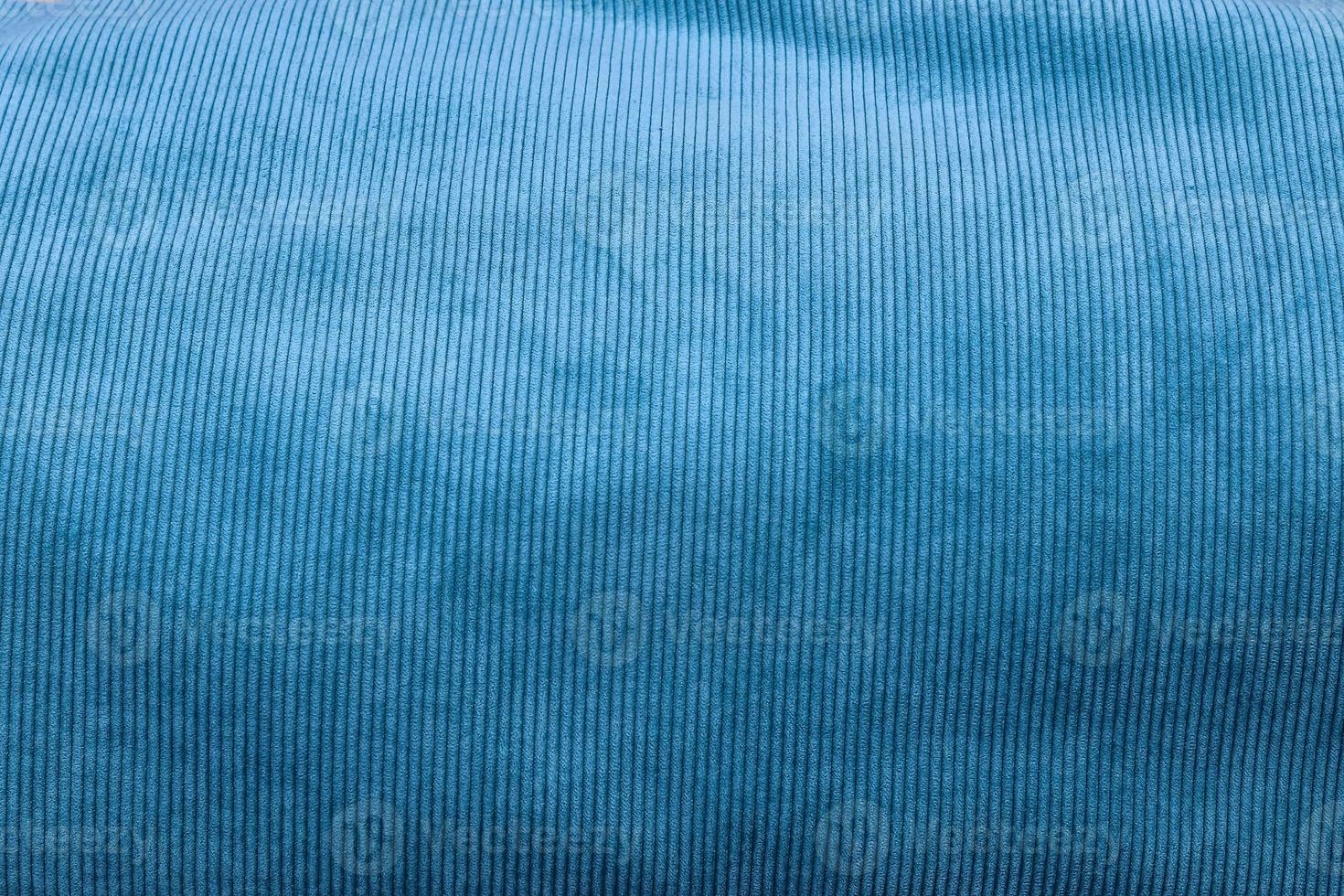 Detailed close up view on samples of cloth and fabrics in different colors found at a fabrics market photo