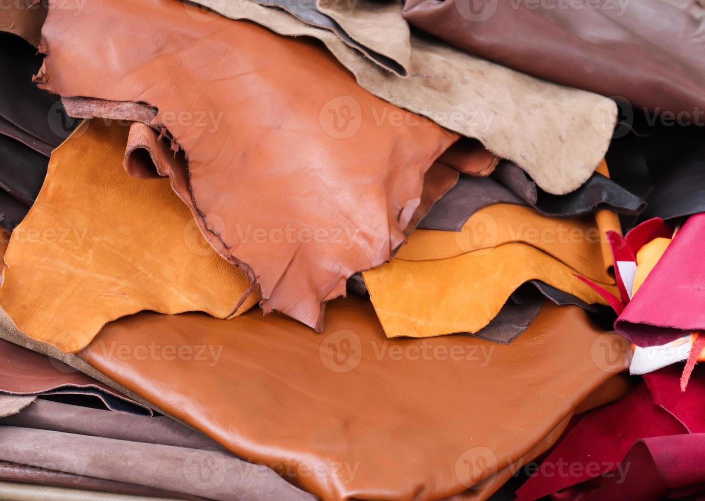 Detailed close up view on samples of cloth and fabrics in different colors found at a fabrics market photo