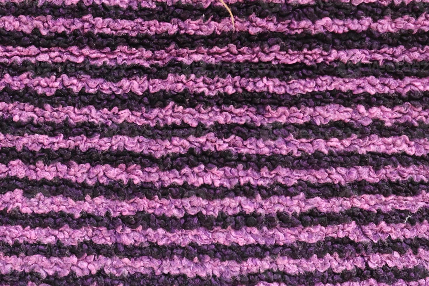 Detailed close up view on samples of cloth and fabrics in different colors found at a fabrics market photo