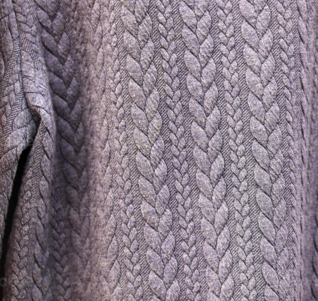Detailed close up view on samples of cloth and fabrics in different colors found at a fabrics market photo