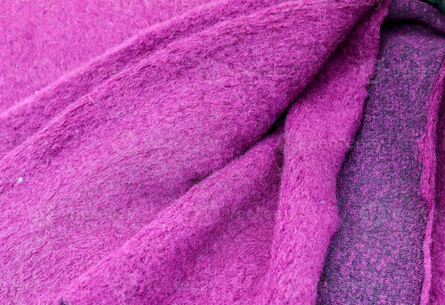 Detailed close up view on samples of cloth and fabrics in different colors found at a fabrics market photo