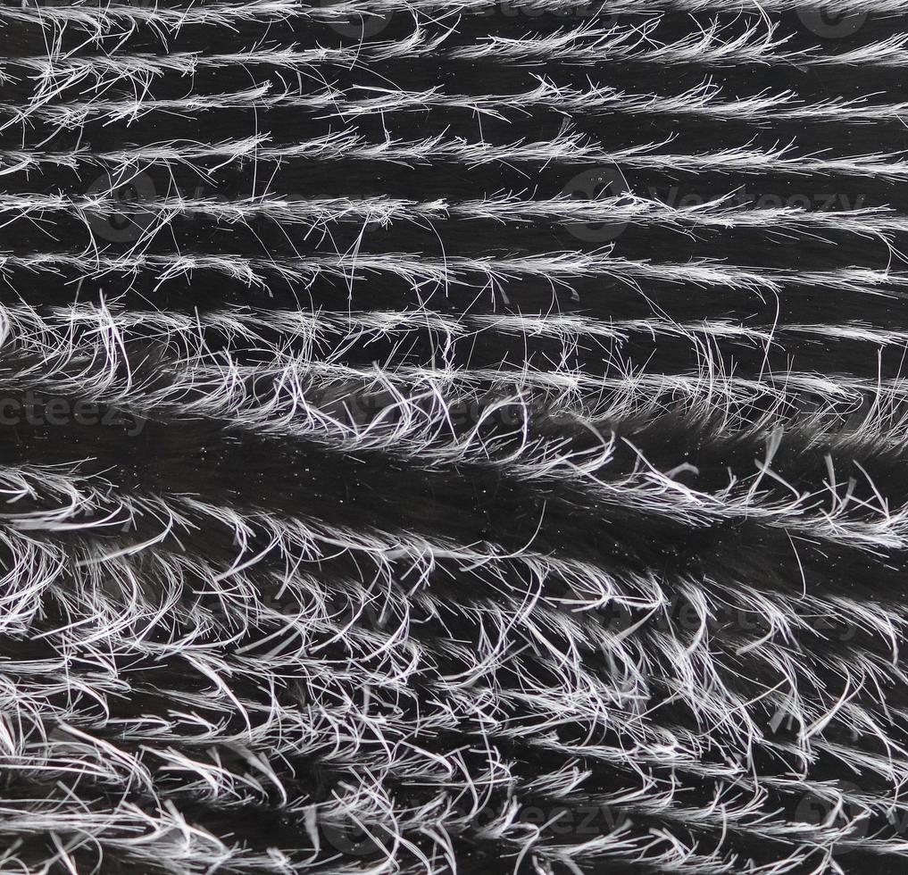 Detailed close up view on samples of cloth and fabrics in different colors found at a fabrics market photo