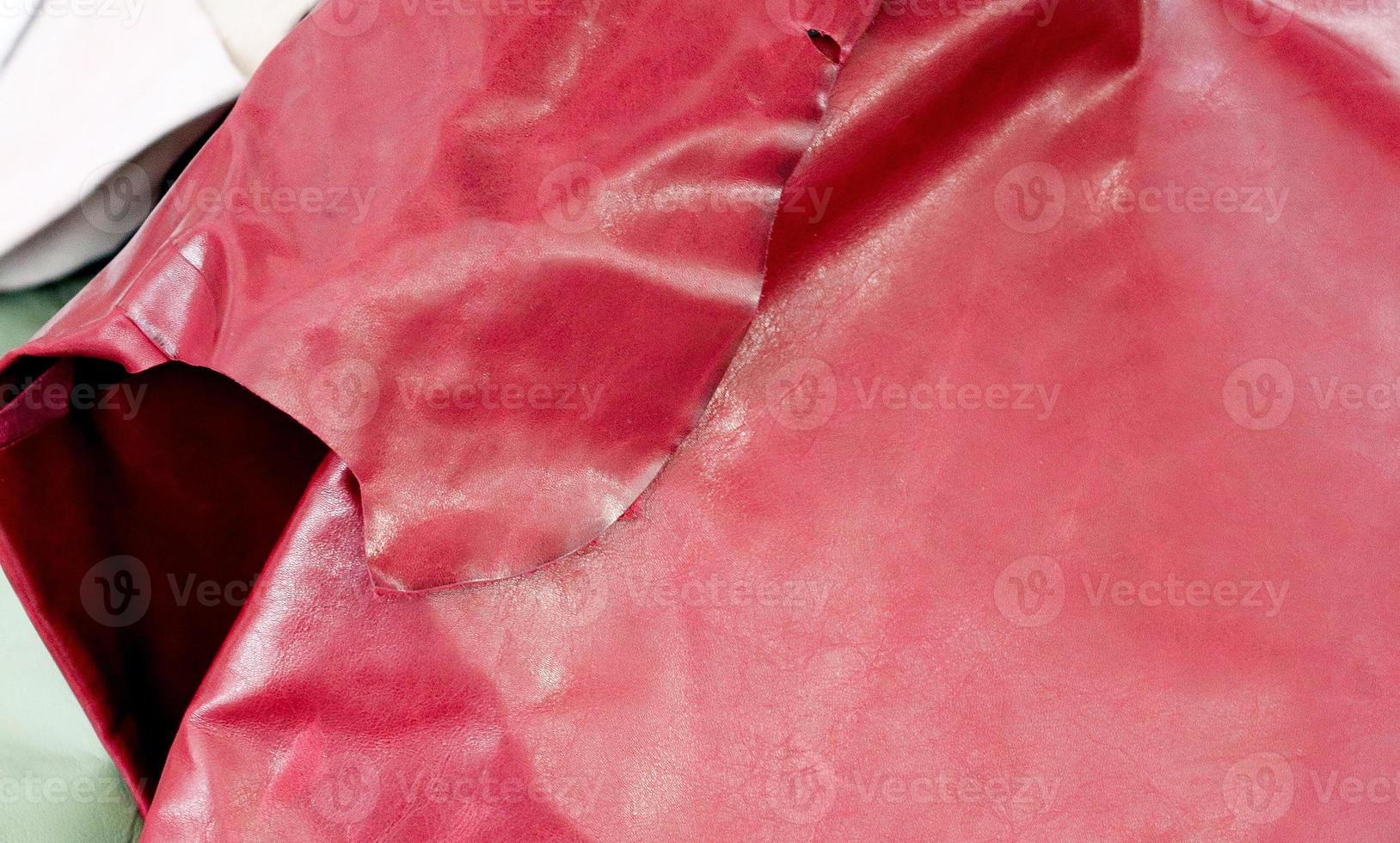 Detailed close up view on samples of cloth and fabrics in different colors found at a fabrics market photo
