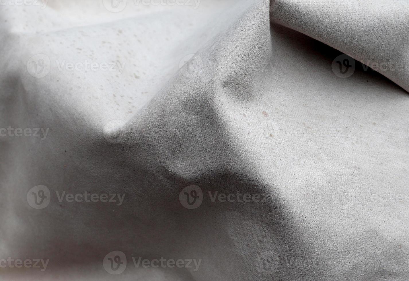 Detailed close up view on samples of cloth and fabrics in different colors found at a fabrics market photo