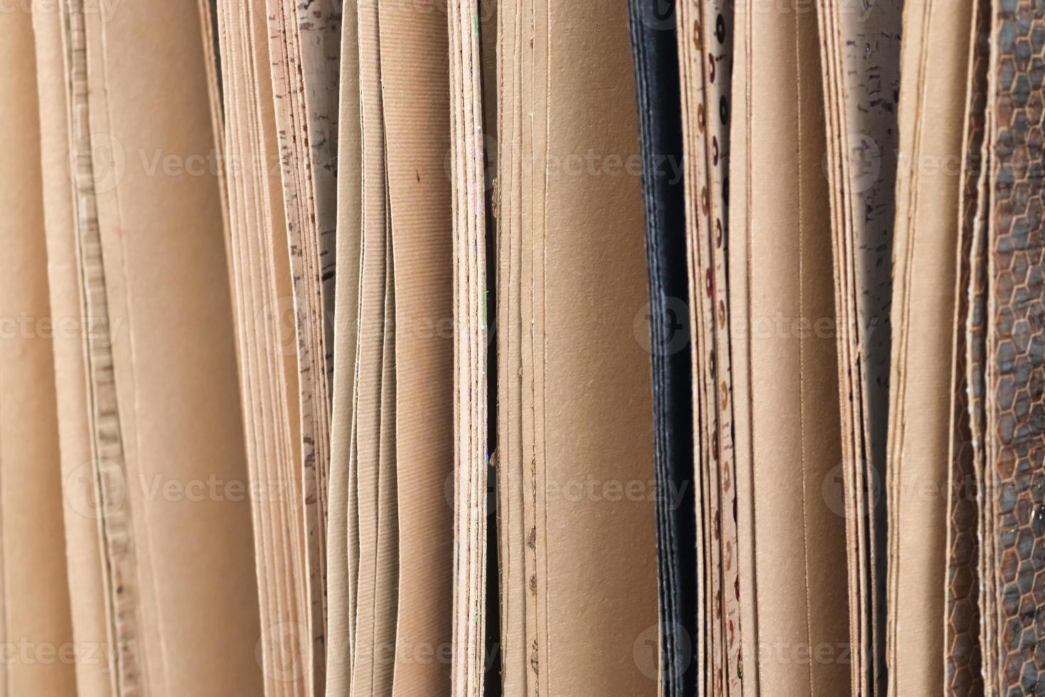 Detailed close up view on samples of cloth and fabrics in different colors found at a fabrics market photo