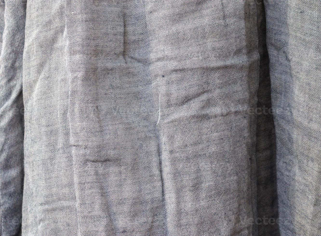 Detailed close up view on samples of cloth and fabrics in different colors found at a fabrics market photo