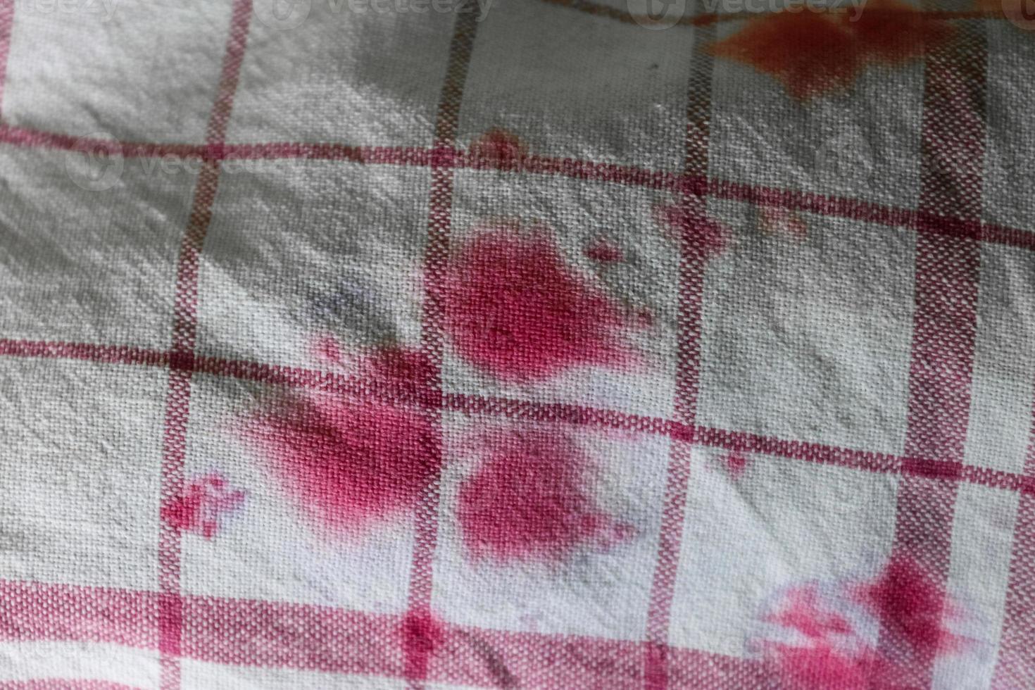 Detailed close up view on samples of cloth and fabrics in different colors found at a fabrics market photo