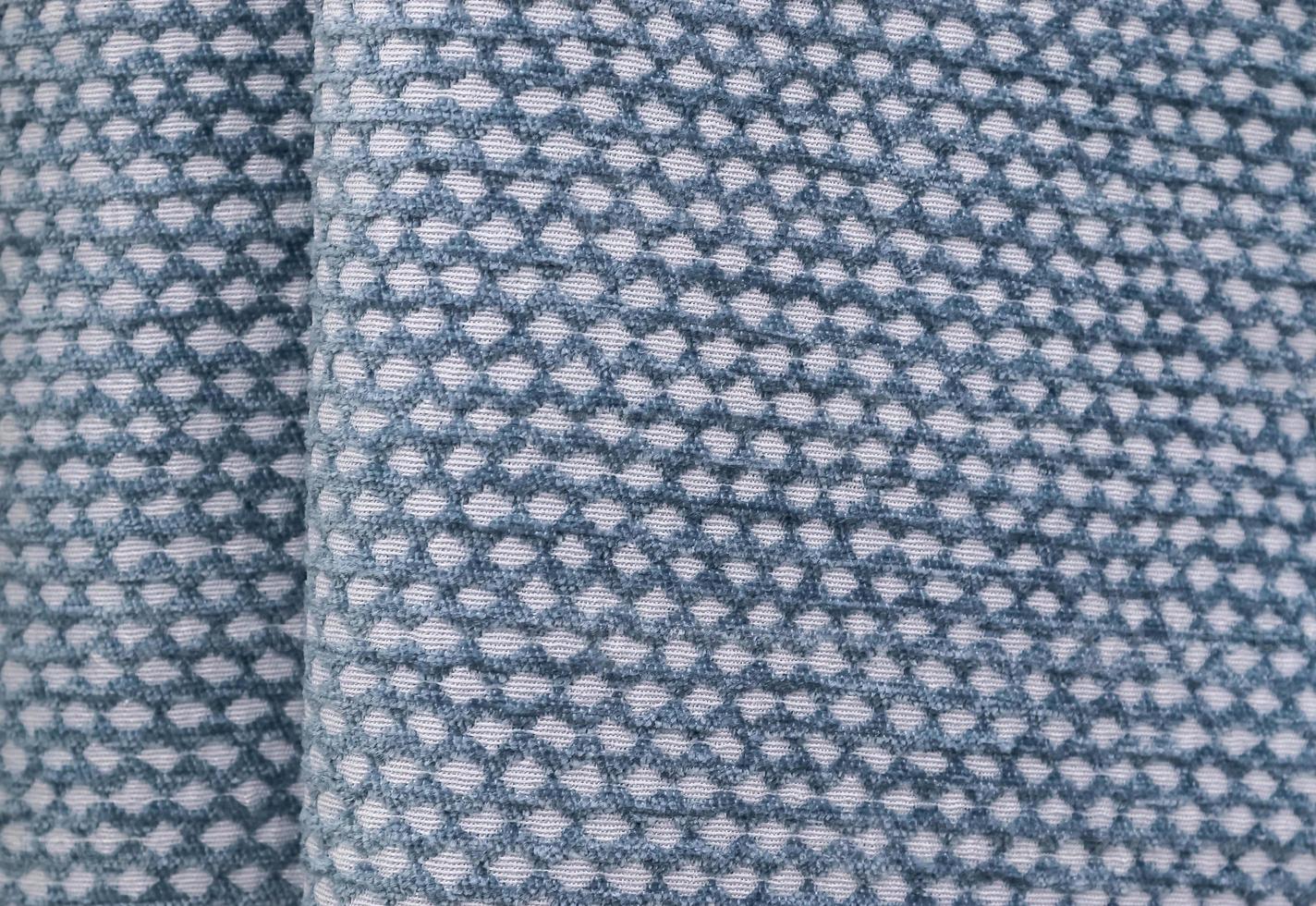 Detailed close up view on samples of cloth and fabrics in different colors found at a fabrics market photo