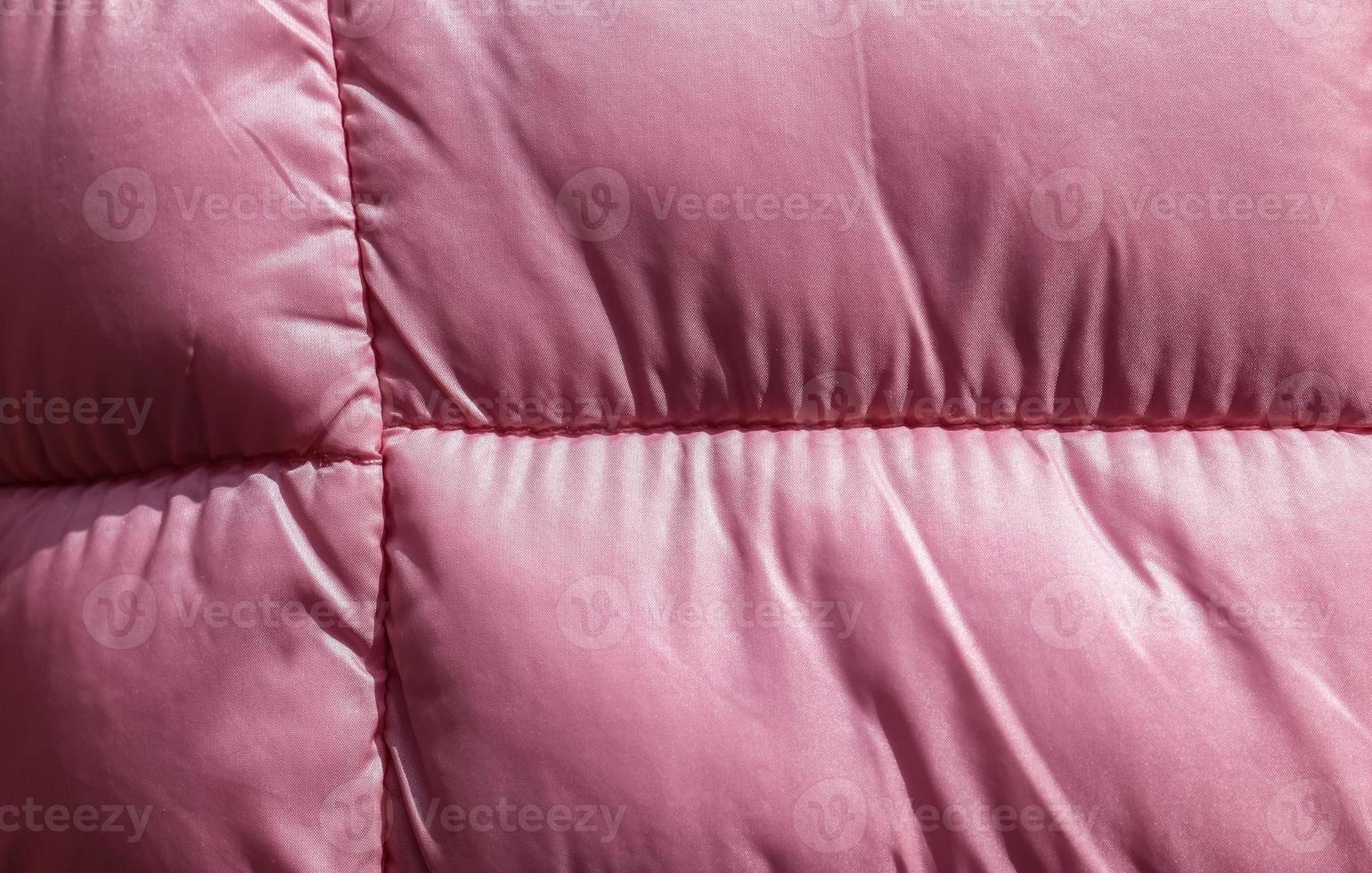 Detailed close up view on samples of cloth and fabrics in different colors found at a fabrics market photo