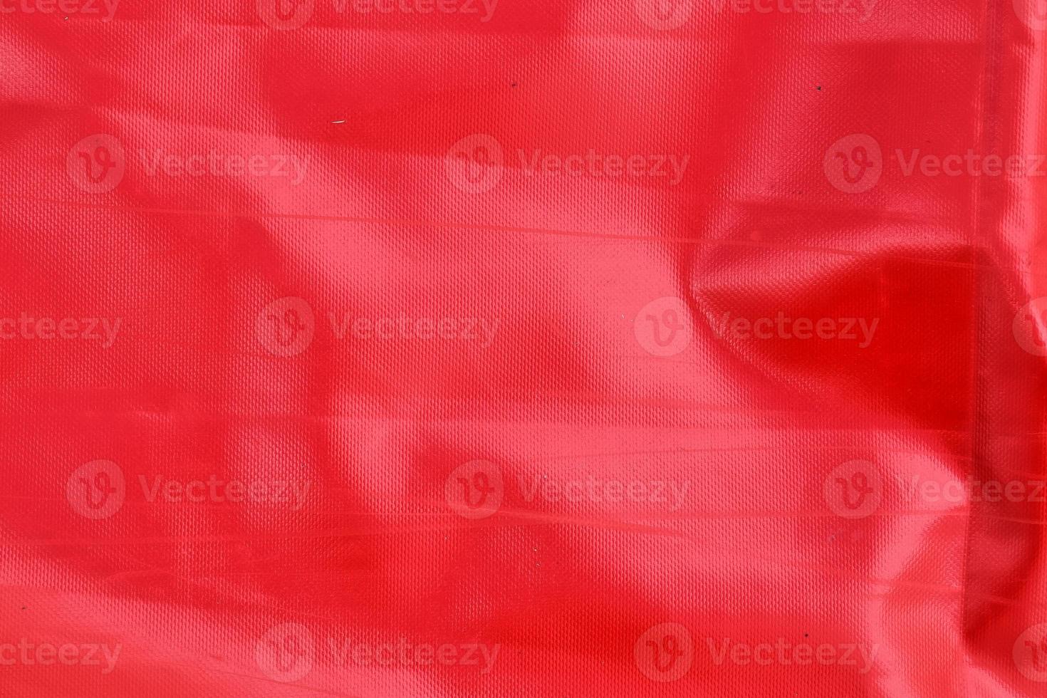 Detailed close up view on samples of cloth and fabrics in different colors found at a fabrics market photo